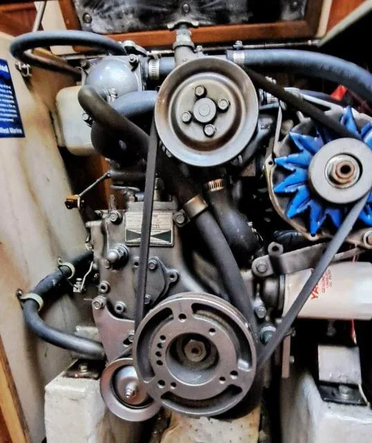 Slide: The Image of 1987 C&C 38 MKIII engine with belts and hoses in a compact setup. - 19