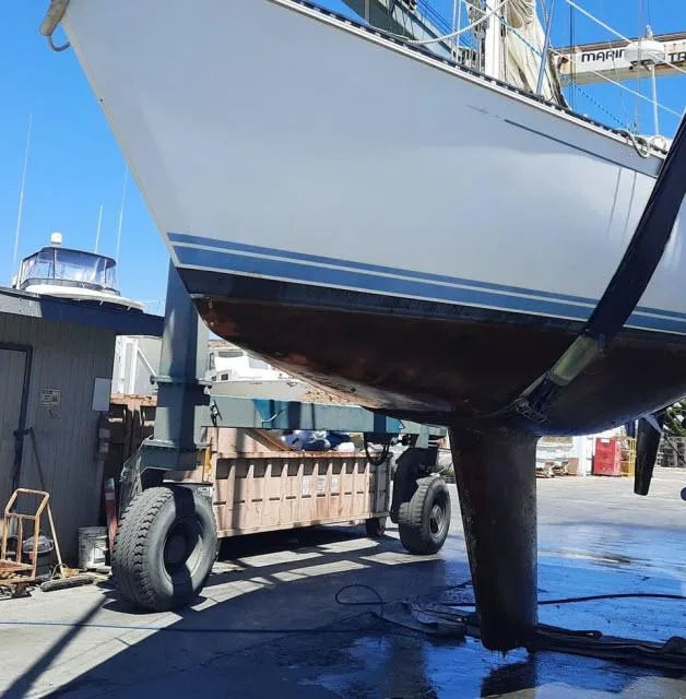 Slide: The Image of 1987 C&C 38 MKIII sailboat on dry dock for maintenance. - 24