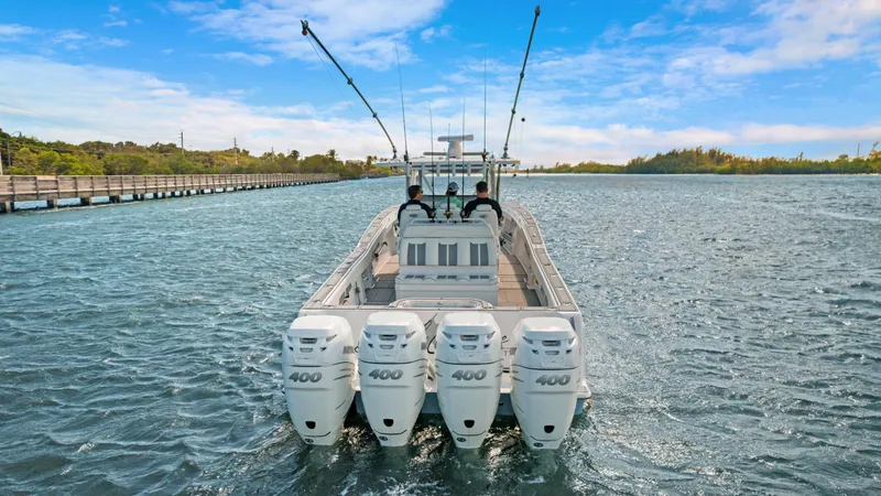Slide: The Image of 2021 Invincible 42 Center Console Cabin with four 400 HP engines on water. - 9