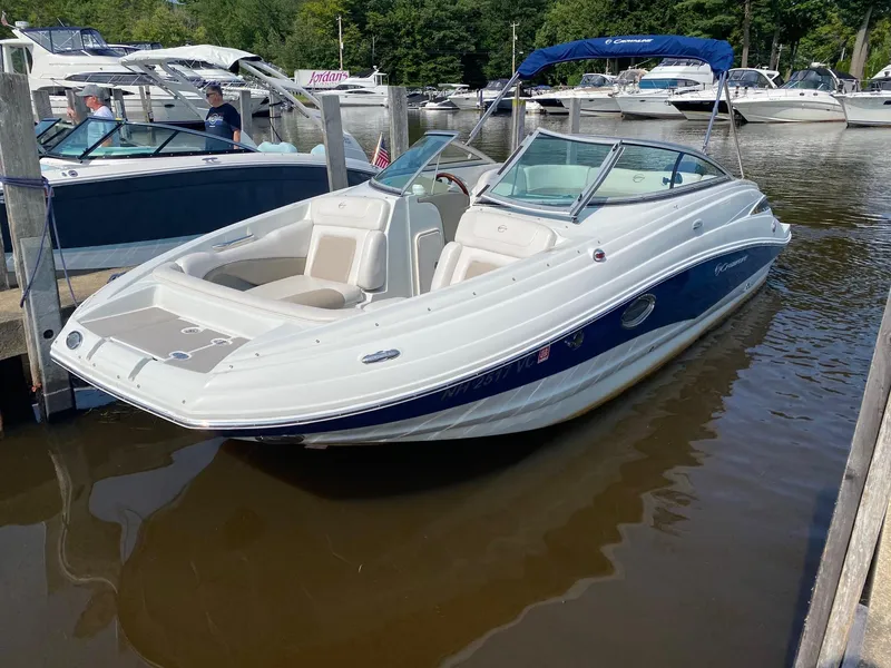 Slide: The Image of 2015 Crownline Eclipse E2 boat docked in a marina, featuring sleek design and spacious seating. - 1