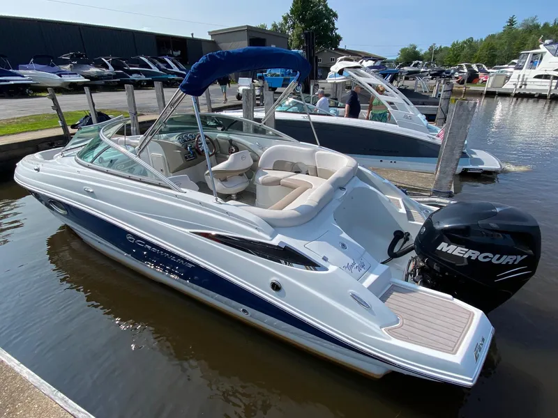 Slide: The Image of 2015 Crownline Eclipse E2 boat docked with Mercury outboard motor. - 15