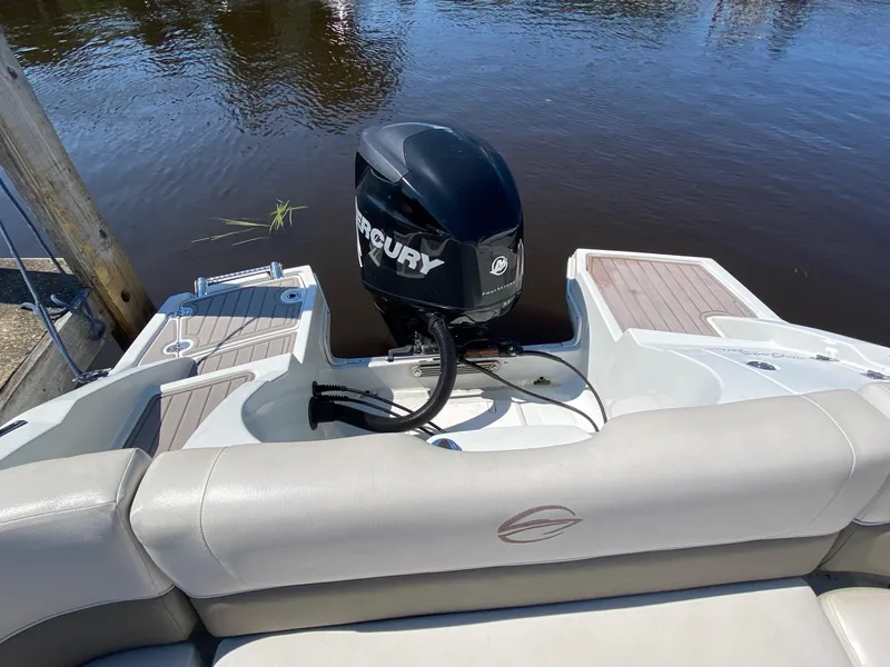 Slide: The Image of 2015 Crownline Eclipse E2 boat with Mercury outboard motor on calm water. - 10