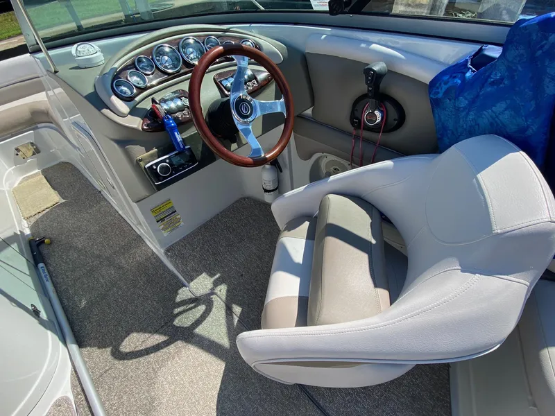 Slide: The Image of 2015 Crownline Eclipse E2 boat interior with steering wheel and dashboard controls. - 11
