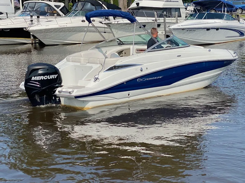 Slide: The Image of 2015 Crownline Eclipse E2 boat with Mercury outboard on water. - 2