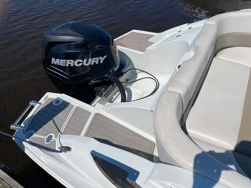 Slide: The Image of 2015 Crownline Eclipse E2 boat with Mercury outboard motor on water. - 5