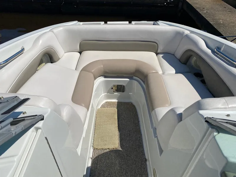Slide: The Image of 2015 Crownline Eclipse E2 boat interior with cushioned seating. - 6