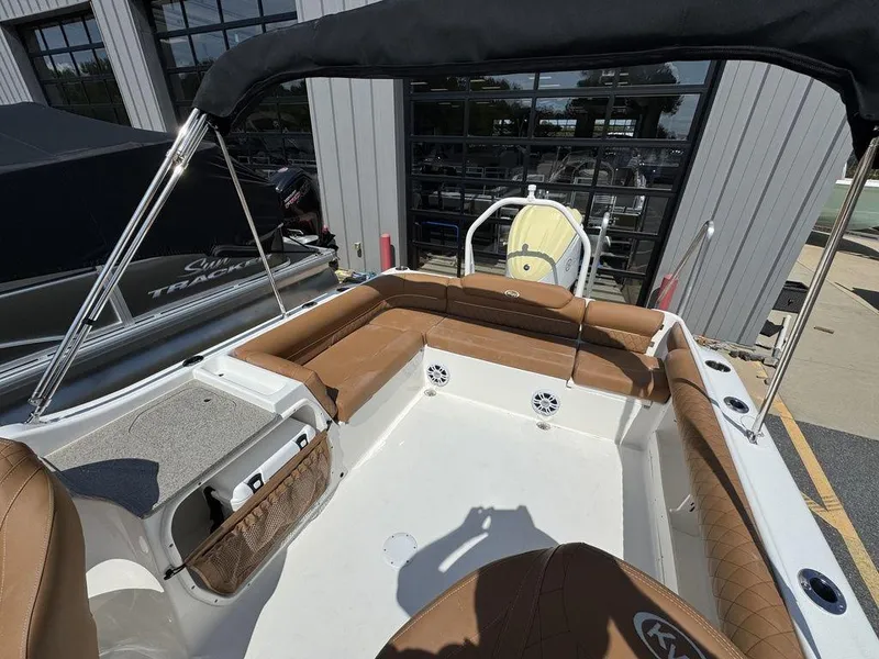 Slide: The Image of 2025 Key West 239 DFS boat interior with tan seating and canopy. - 11