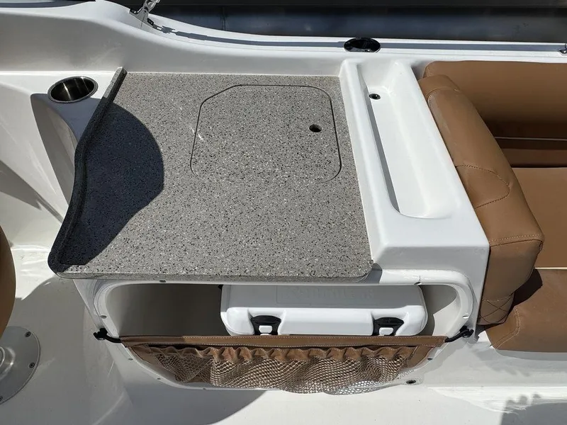 Slide: The Image of Key West 239 DFS 2025 boat interior with seating and storage compartment. - 13