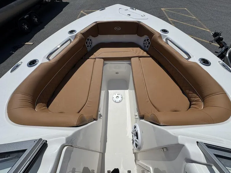 Slide: The Image of 2025 Key West 239 DFS boat with tan seating and spacious deck layout. - 14
