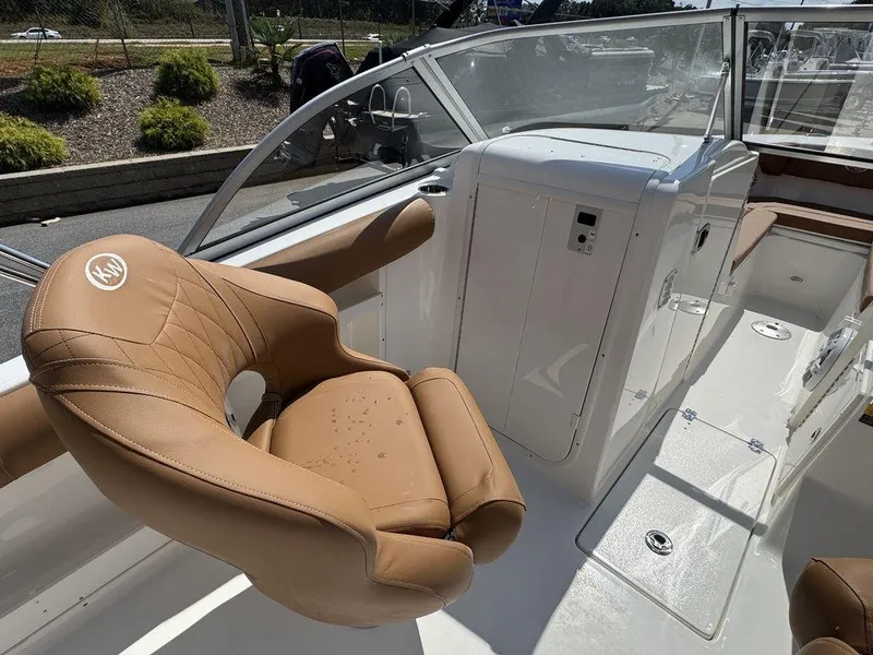 Slide: The Image of 2025 Key West 239 DFS boat interior with tan seating and sleek design. - 19