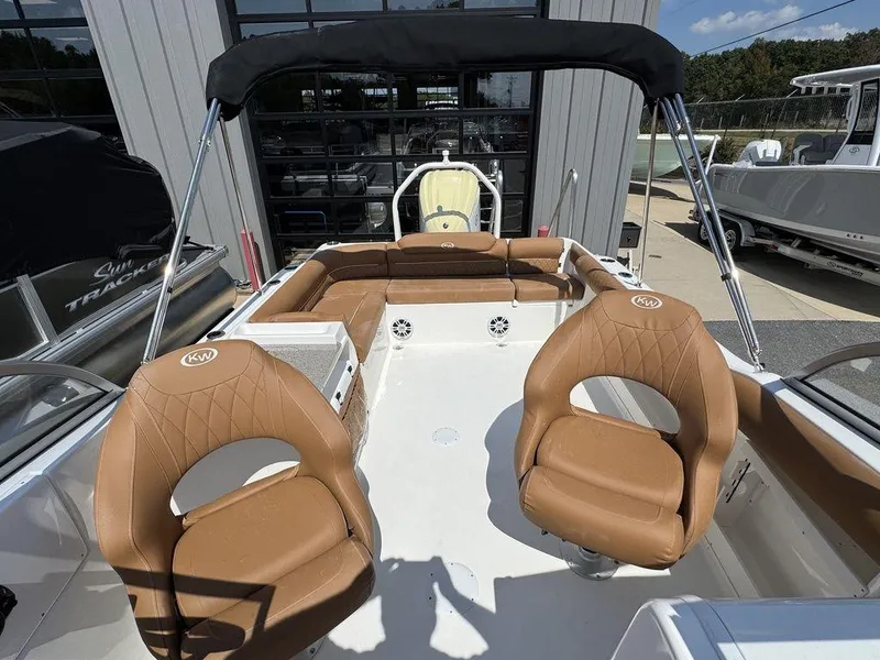 Slide: The Image of 2025 Key West 239 DFS boat interior with tan seating and canopy. - 20