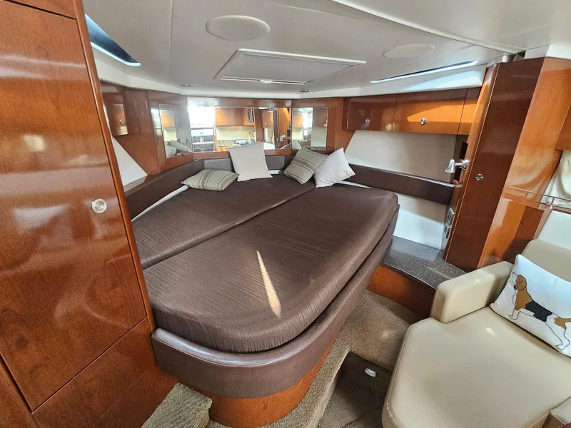 Slide: The Image of Luxurious interior of 2014 Sea Ray 350 Sundancer yacht with cozy bedding. - 19