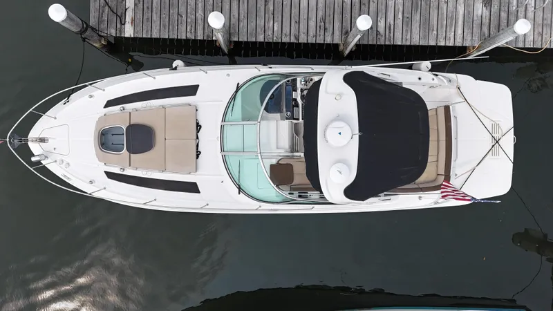 Slide: The Image of Overhead view of a 2014 Sea Ray 350 Sundancer docked at a marina. - 2