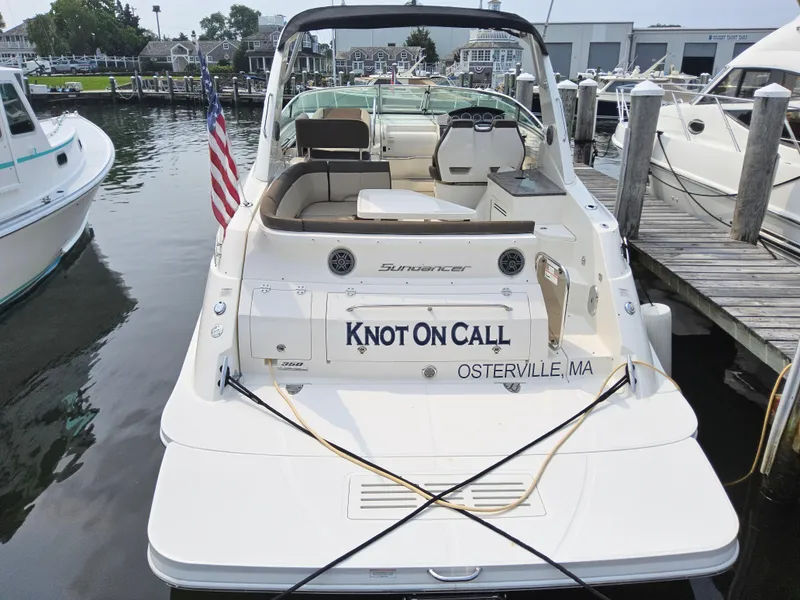 Slide: The Image of 2014 Sea Ray 350 Sundancer docked, rear view with "Knot On Call" name, Osterville, MA. - 3