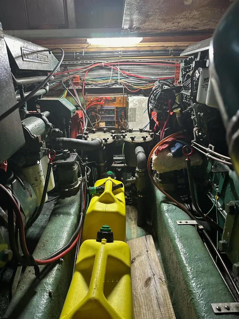Slide: The Image of Engine room of a 1986 Cytra Bavaria 40 boat, featuring mechanical components and wiring. - 22