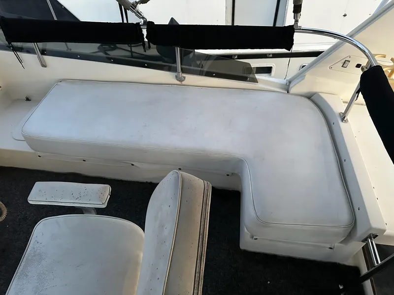 Slide: The Image of White seating area on a 1986 Cytra Bavaria 40 boat deck. - 4