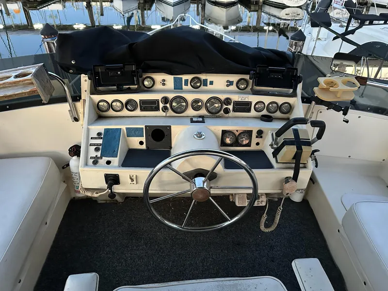 Slide: The Image of Helm of 1986 Cytra Bavaria 40 yacht with steering wheel and control panel. - 5