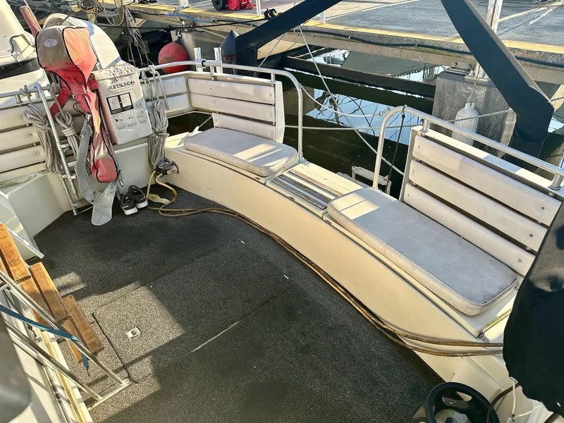 Slide: The Image of Cockpit of 1986 Cytra Bavaria 40 yacht with seating and life jacket. - 7