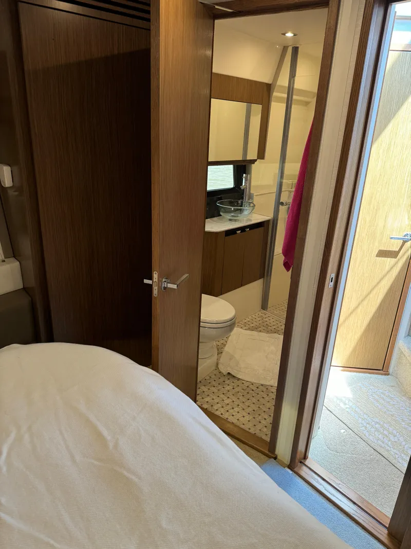 Slide: The Image of Interior of 2017 Sea Ray Sundancer 460 yacht showing bedroom and bathroom. - 14
