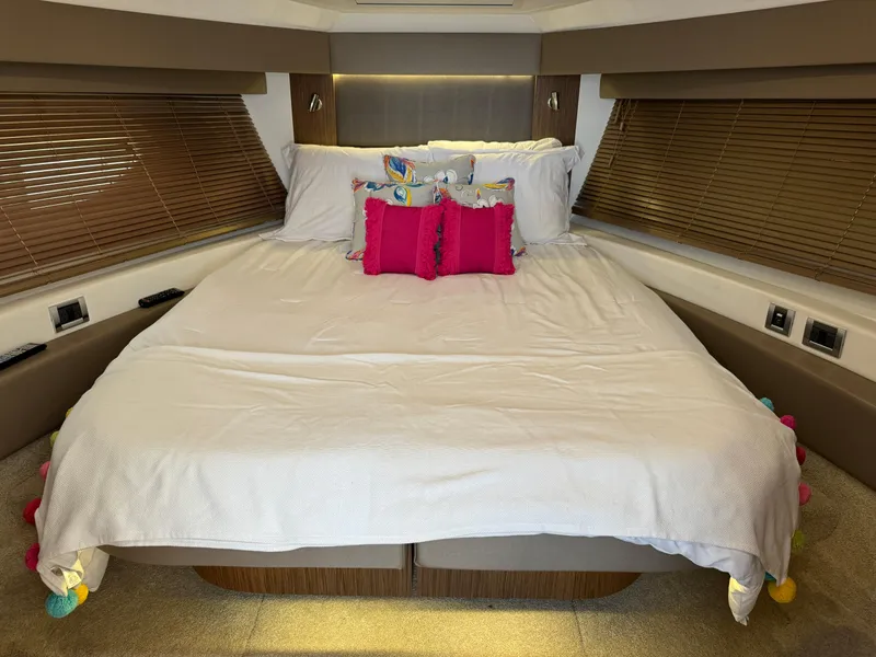 Slide: The Image of Luxurious bedroom interior of 2017 Sea Ray Sundancer 460 yacht with plush bedding. - 16
