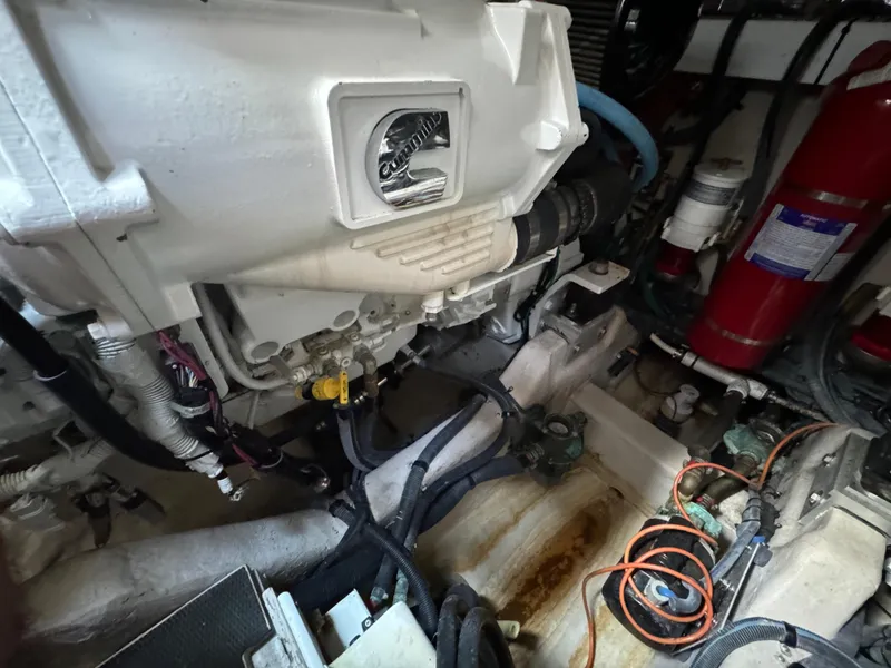 Slide: The Image of Engine room of 2017 Sea Ray Sundancer 460 with visible components and wiring. - 2
