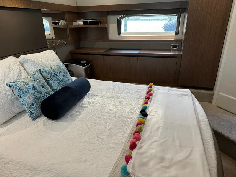 Slide: The Image of Luxurious cabin interior of 2017 Sea Ray Sundancer 460 yacht with elegant bedding. - 25