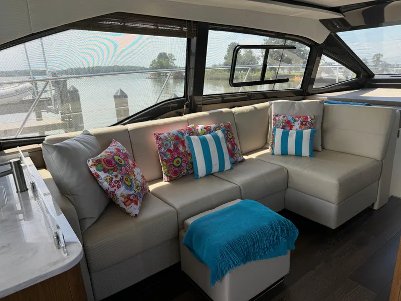 Slide: The Image of Luxurious interior of 2017 Sea Ray Sundancer 460 yacht with stylish seating and colorful cushions. - 41