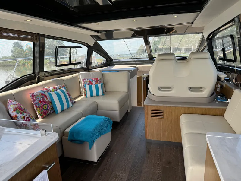 Slide: The Image of Luxurious interior of 2017 Sea Ray Sundancer 460 yacht with plush seating and vibrant decor. - 43