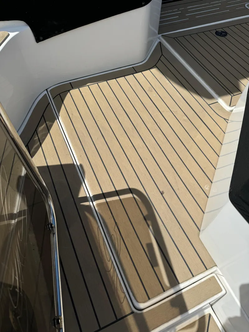 Slide: The Image of 2017 Sea Ray Sundancer 460 deck with sleek, modern design and wood-like finish. - 7