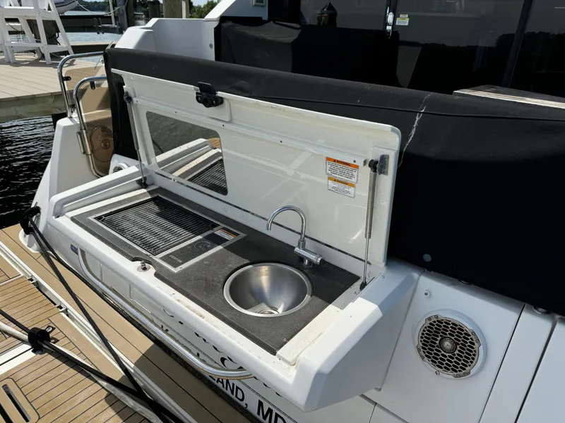Slide: The Image of Outdoor kitchenette on 2017 Sea Ray Sundancer 460 yacht with sink and grill. - 9