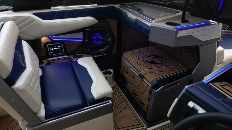 Slide: The Image of 2024 Tigé Ultré 23ZX interior with blue LED lighting and luxurious seating. - 12