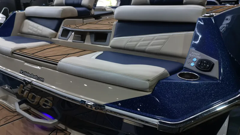 Slide: The Image of 2024 Tigé Ultré 23ZX boat with luxurious seating and sleek design. - 14