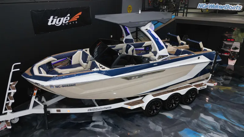 Slide: The Image of 2024 Tigé Ultré 23ZX boat on trailer, showcased indoors. - 17