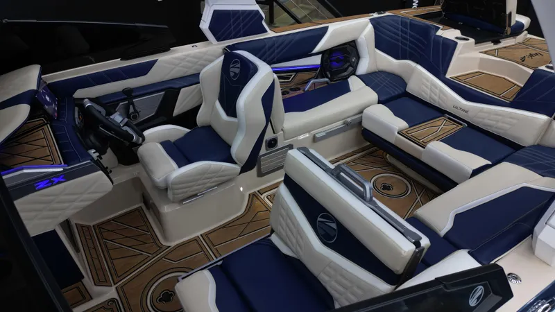 Slide: The Image of Luxurious interior of 2024 Tigé Ultré 23ZX boat with blue and white seating. - 9