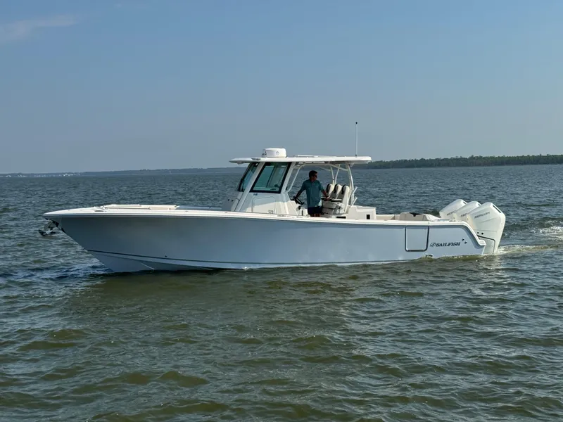 The Image of 2024 Sailfish 360 CC boat cruising on open water. - 1