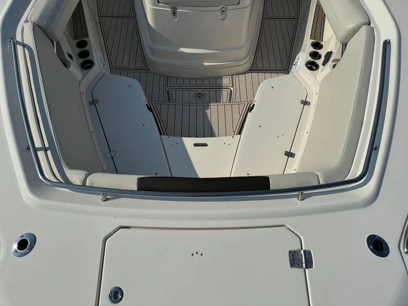Slide: The Image of 2024 Sailfish 360 CC boat interior with seating and cup holders. - 17