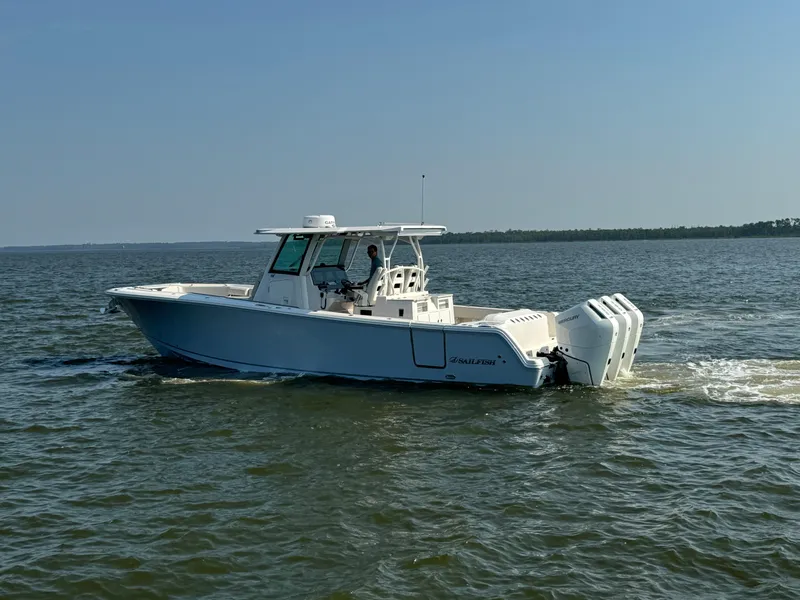 Slide: The Image of 2024 Sailfish 360 CC boat cruising on open water. - 3