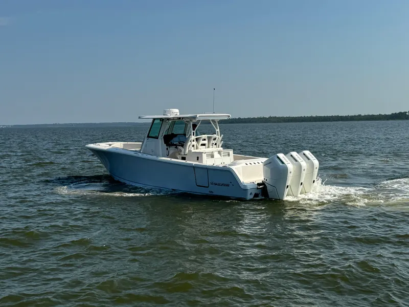 Slide: The Image of 2024 Sailfish 360 CC boat cruising on open water. - 4