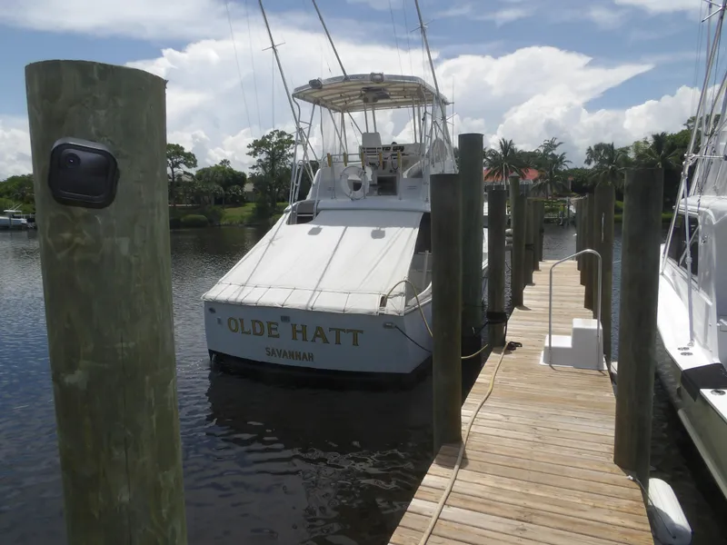 The Image of 1967 Hatteras Convertible boat docked at marina, named "Olde Hatt" from Savannah. - 0