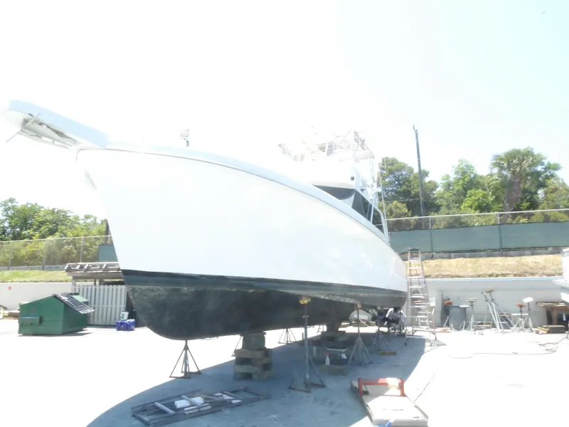 Slide: The Image of 1967 Hatteras Convertible boat on dry dock for maintenance. - 12