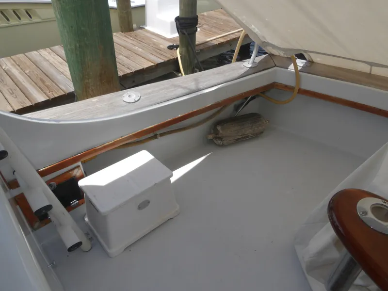 Slide: The Image of 1967 Hatteras Convertible boat deck with storage box and wooden trim. - 29