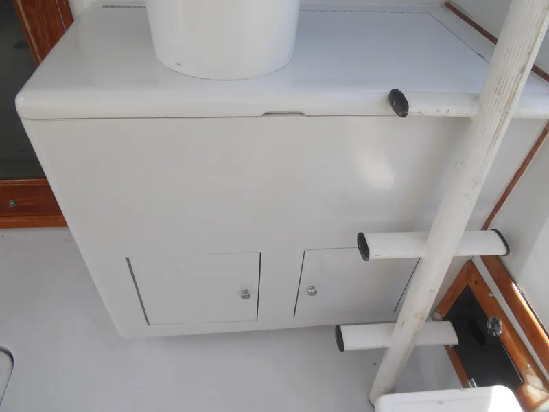 Slide: The Image of 1967 Hatteras Convertible boat interior with storage cabinet and ladder. - 31
