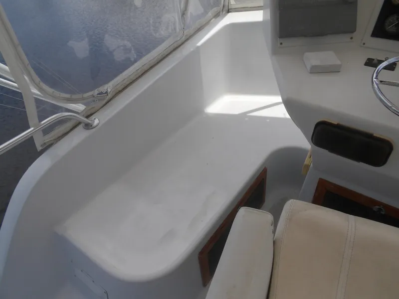 Slide: The Image of 1967 Hatteras Convertible boat interior with seating and steering area. - 36