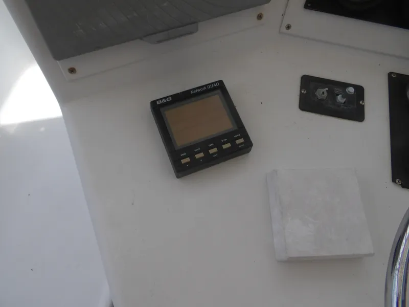 Slide: The Image of 1967 Hatteras Convertible boat dashboard with B&G Network Quad display. - 39