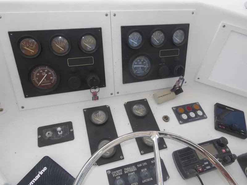 Slide: The Image of 1967 Hatteras Convertible boat dashboard with gauges and controls. - 42