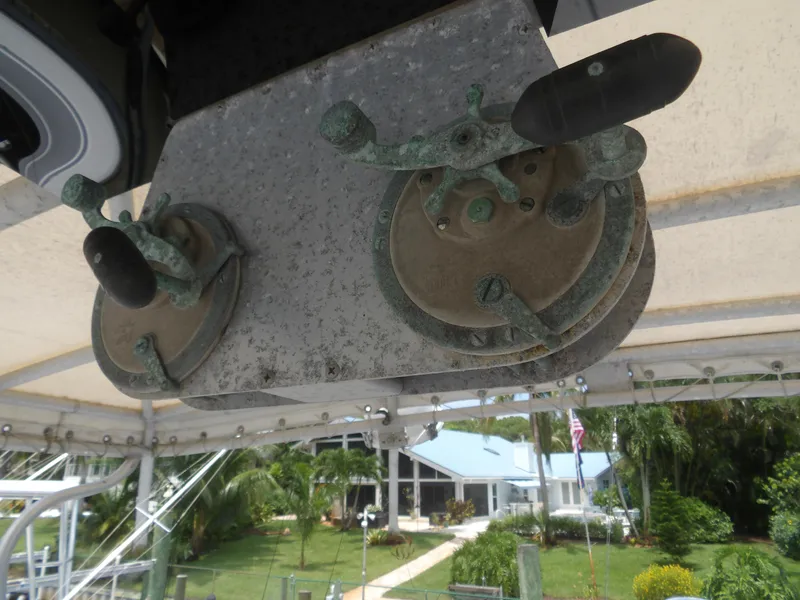 Slide: The Image of Vintage 1967 Hatteras Convertible boat controls with weathered metal levers. - 43