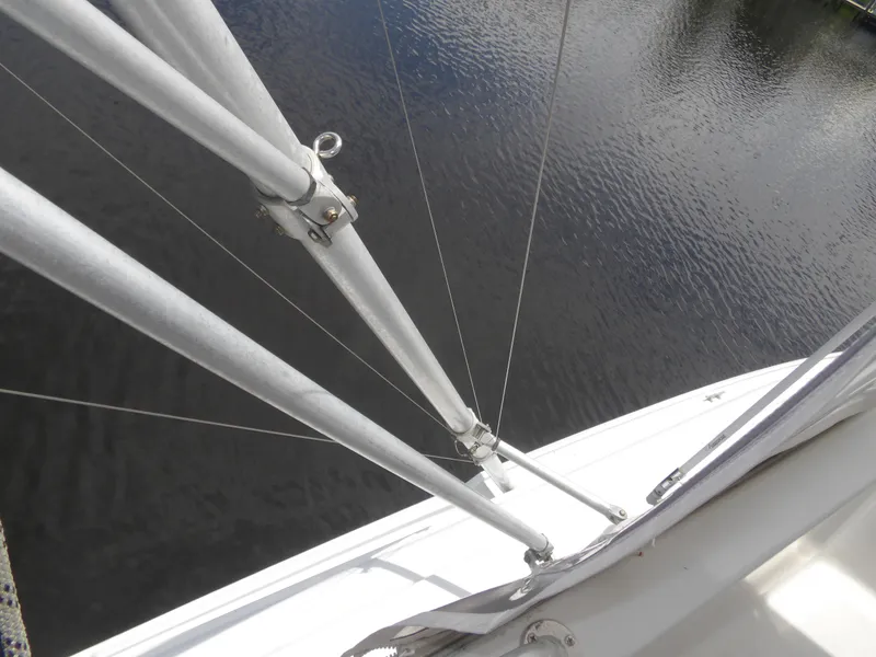 Slide: The Image of 1967 Hatteras Convertible yacht rigging over calm water. - 45