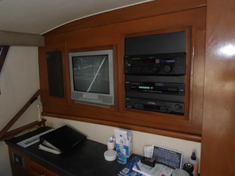 Slide: The Image of 1967 Hatteras Convertible interior with vintage TV and audio equipment. - 48