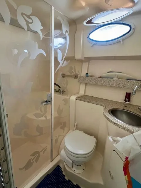 Slide: The Image of Bathroom interior of 2000 Rinker Fiesta Vee 342 boat with shower and sink. - 15