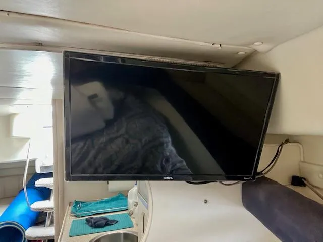 Slide: The Image of Flat-screen TV inside 2000 Rinker Fiesta Vee 342 boat cabin. - 16
